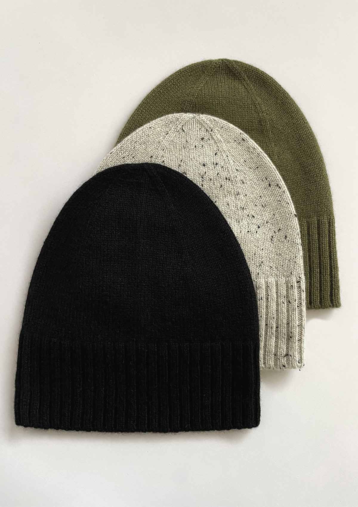 UNisex cashmere beanies in light grey, black and green by Leophil with an adjustable rib knit cuff and a dome shaped crown.