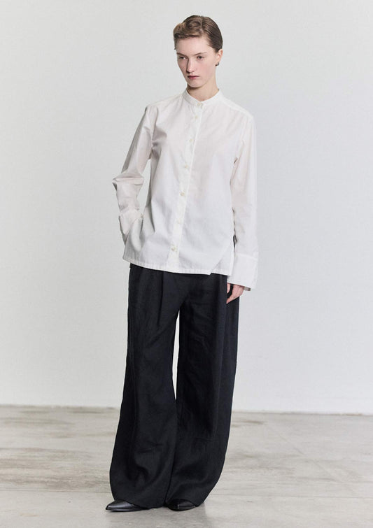 Model wearing slim fit white cotton Women's shirt by Leophil