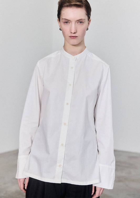 Model wearing slim fit white cotton Women's shirt with banded collar and Corozo buttons by Leophil